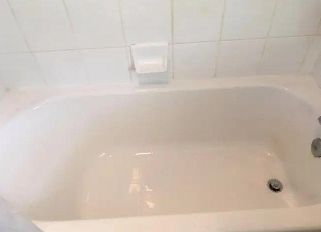 Spotless, sanitized bathtub after an Amelia Shine Cleaning Services deep clean