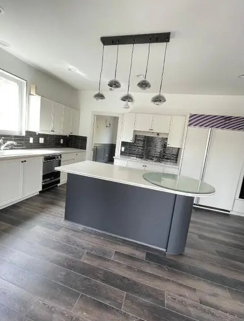Same kitchen, spotless and move-in ready, after cleaning